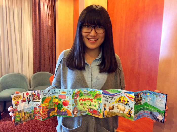 Ruowei Ding and her "accordion journal" from the Mixed-Media Travel Journal class.
