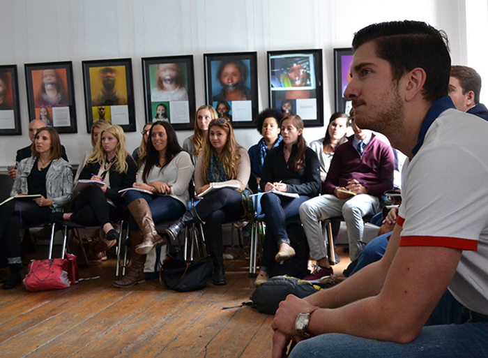 Public health students actively listen to Dr. Fitzgerald's insights on Ebola.