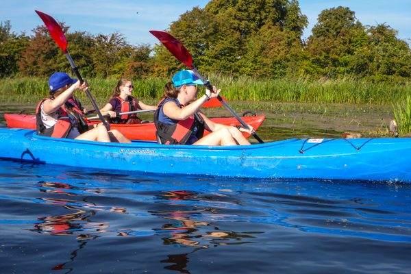 The trio goes kayaking in Gdansk, Poland, one of the many outdoor adventures they have set out on during the voyage.