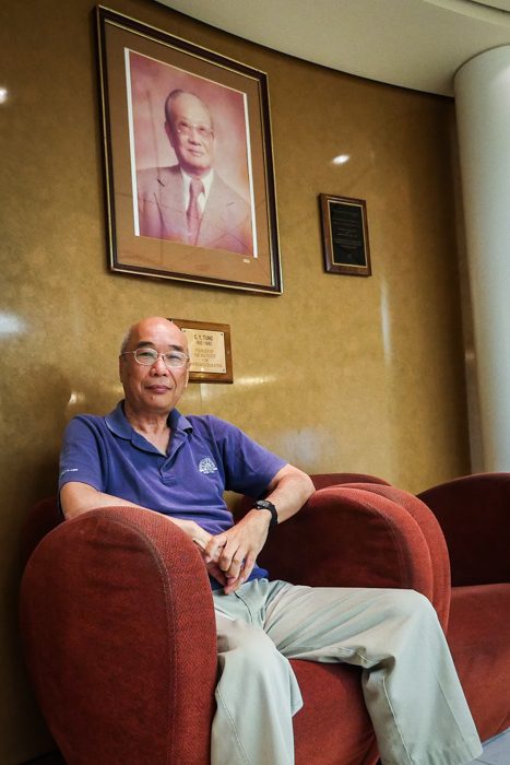 Ho relaxes in his favorite chair on the ship, as he enjoys watching members of the shipboard community pass by throughout the academic day.