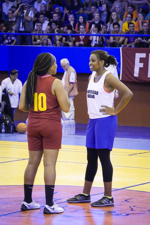 Rawls shares a moment with a fellow basketball player from the University of Havana.