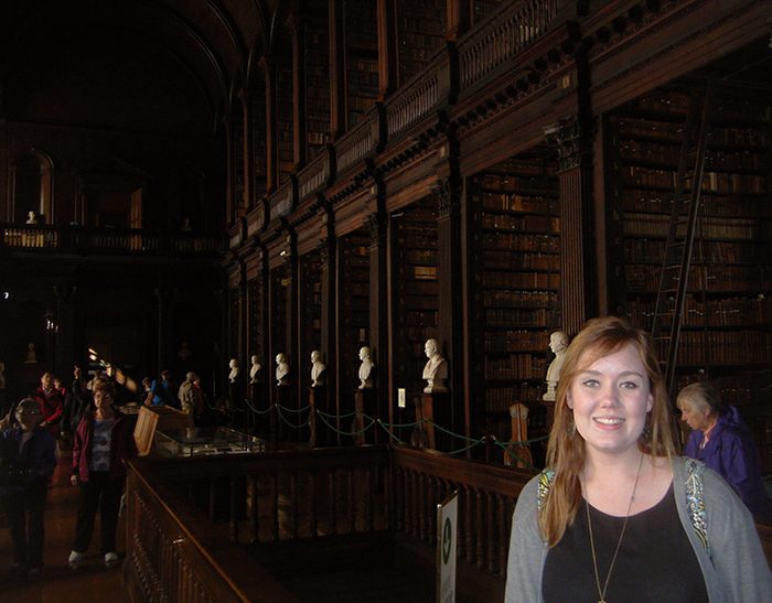 Allie Krumel of Rockhurst University enjoying some time exploring Trinity College's Old Library.