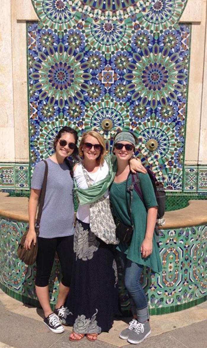 Sarah Pitts (left) with her sister Emily Pitts (center) and SAS alumnus Sara Spear (right) in front of the Hassan II Mosque in Casablanca, Morocco. Pitts's older sister and her SAS roommate connected with her during the Fall 2014 voyage.