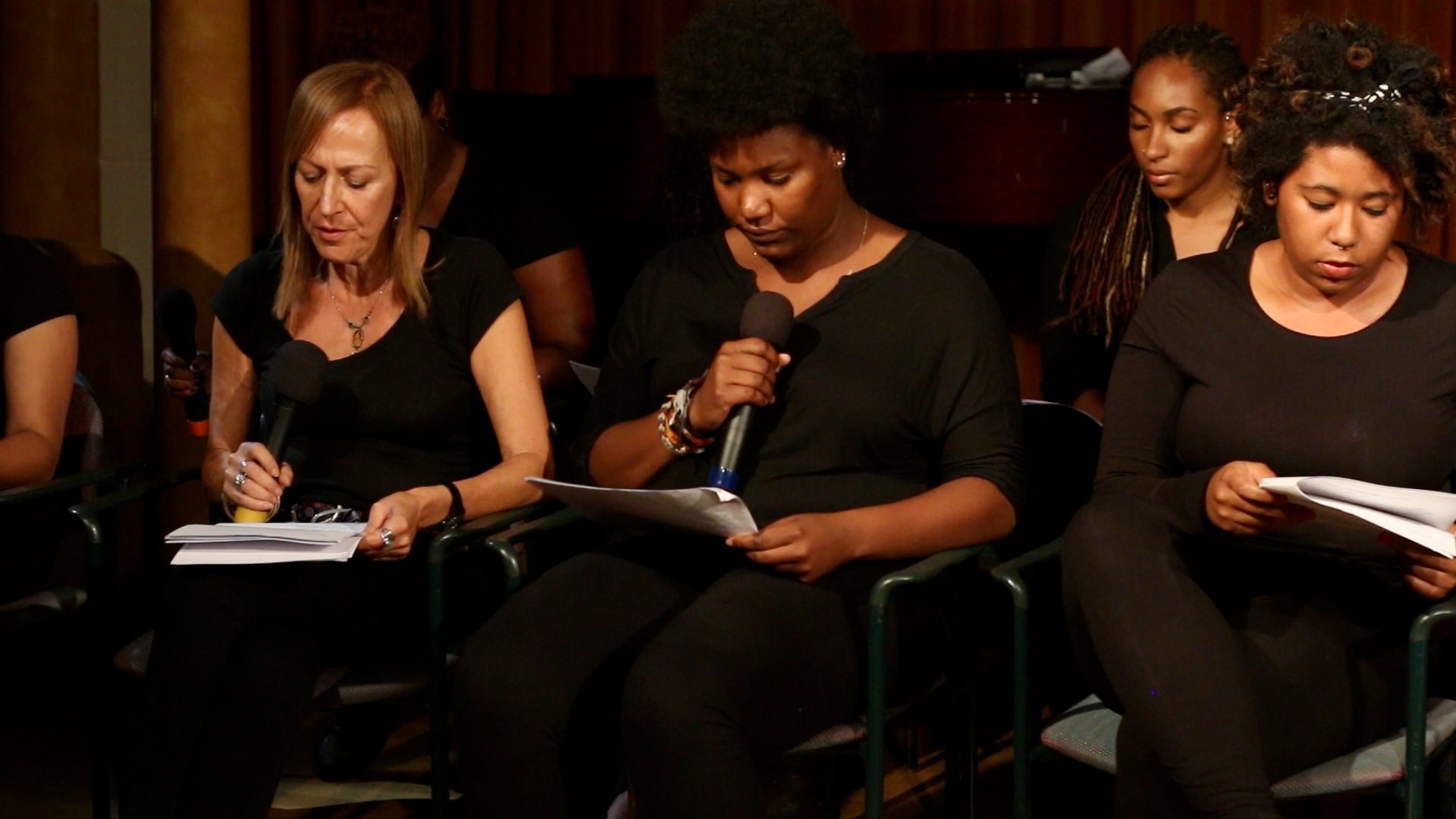 Annuli Tuck participates in a reading alongside fellow students and faculty during the ship's Atlantic Crossing series.