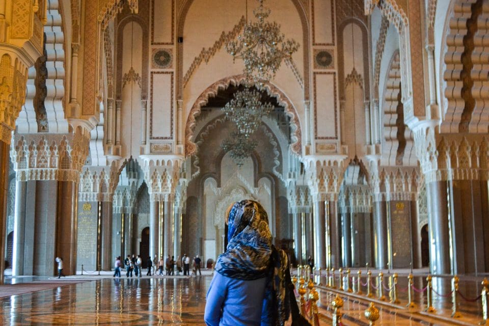 Teaching Assistant Jacqueline Welch stands inside the Hassan II Mosque, appreciating its grand structure.