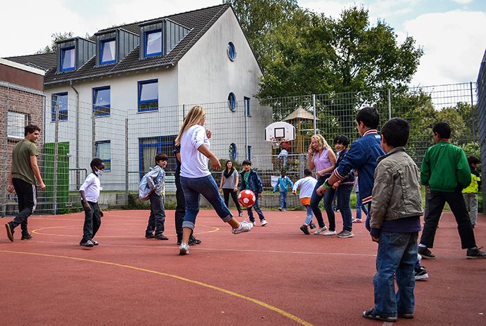 Students were invited to join children living in the village for a game of soccer.