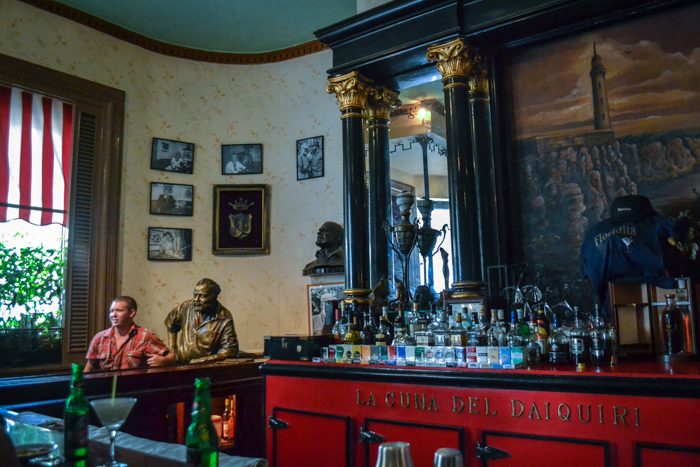 A bar in Havana, La Floridita, was frequented by Ernest Hemingway and still displays his statue today. This locale where frozen daiquiris were invented in the 1930s.