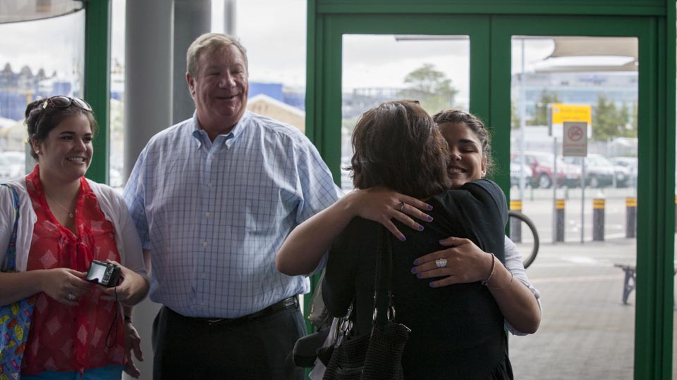 Kelly Garcia, an Art History major from Georgia College and State University, hugs her family goodbye in the ship terminal.
