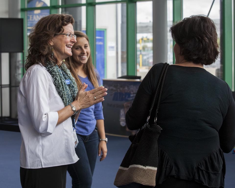 Executive Dean Marti Fessenden brings her smile to the ship terminal to meet students and reassure parents that their children will be off 