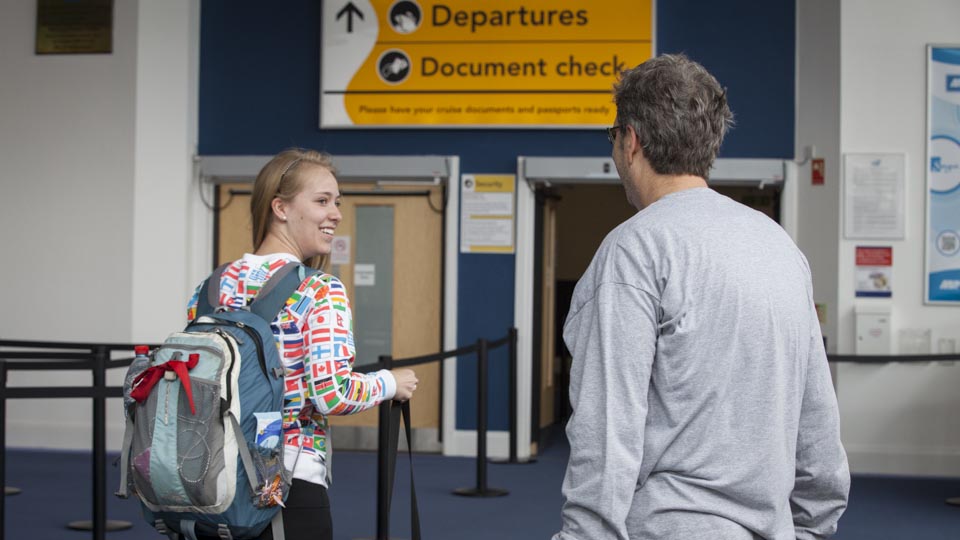 University of Utah student Madeline Rencher looks back at her father Jaryl one last time at the first security checkpoint.
