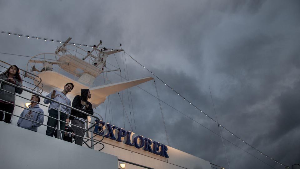 As the sun begins to set amongst the clouds in Southampton, lights come on aboard the MV Explorer and students begin to gather on the outer decks for their first departure.