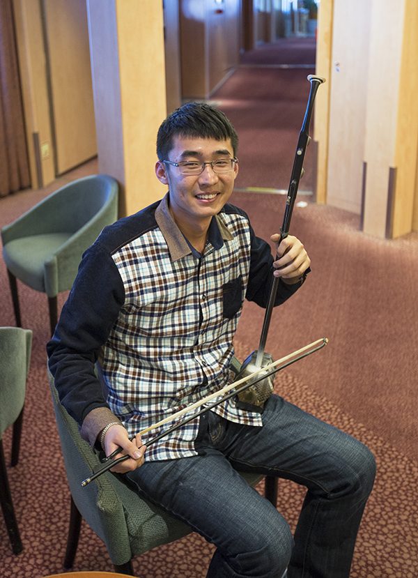 Zhentao shows his erhu, a traditional Chinese string instrument
