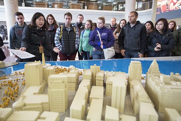 Students view a model of old Shanghai