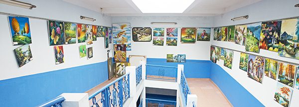 The halls of Maison Chance are filled with colorful paintings by new artists.