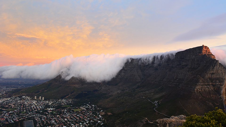 University of Colorado Boulder post grad student Hannah Zdanowitz captured this photo of the clouds rolling over Table Mountain into Cape Town from the summit of Lion's Head.