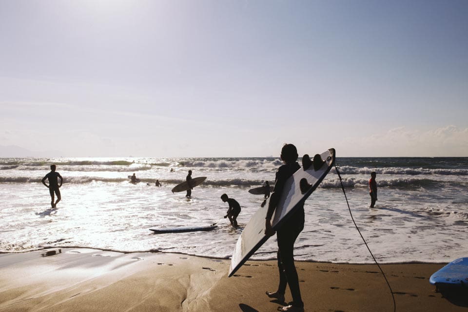 Surfers brave powerful waves on the coast near the quaint town of Sopelana. Austin Harris of Seattle Pacific University