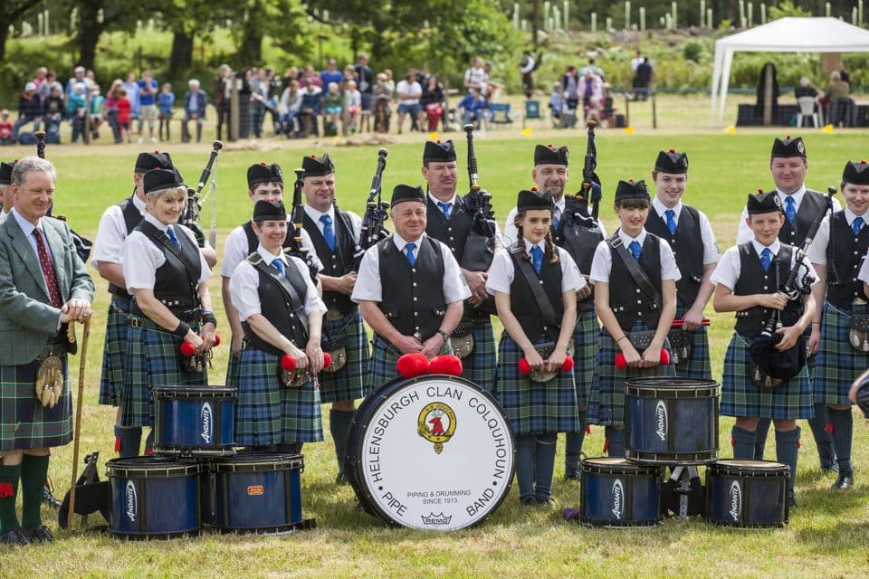 The Helensburgh Clan Colquhoun Pipe Band poses for a photo with the clan chieftain, Sir Malcolm Colquhoun. The band was founded in 1913 and is one of the longest established non-military pipe bands still in existence. 