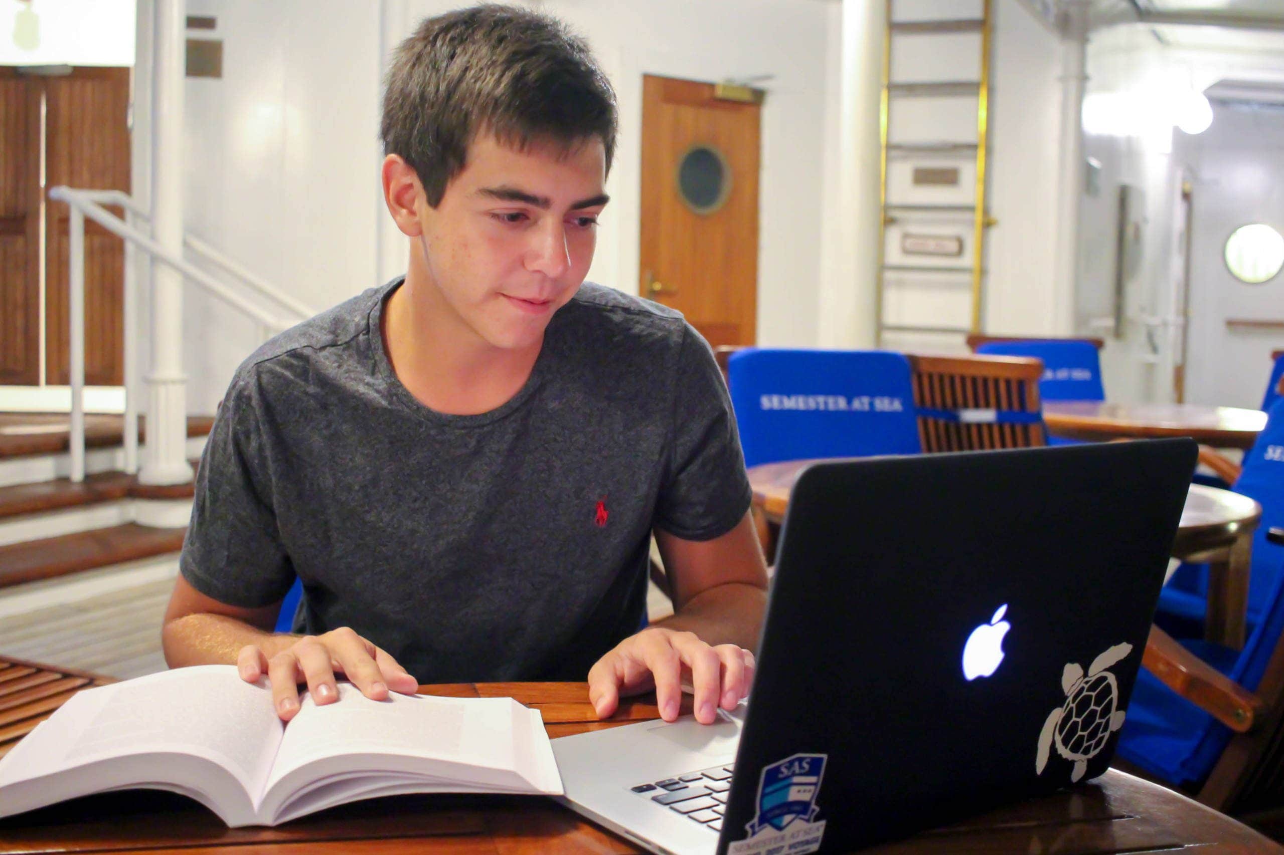 Daniel Lebovitz, Spring 2017 student studying on the Lido Deck