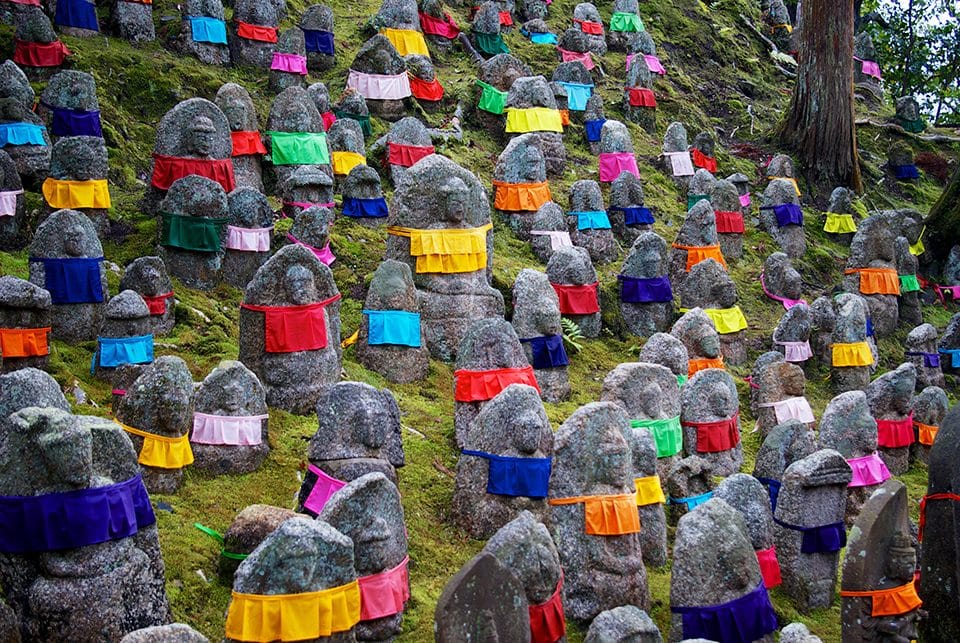 In Buddhism, Ojizosan is the deity of unborn children. Parents build the small Ojizosan statues and cover them in aprons and robes to disguise and protect the children from demons. Caleb Pietrafesa of Cornell University took this photo of the Ojizosan statues outside Kiyomizu-dera temple in Kyoto.