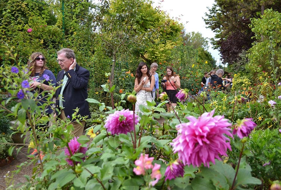 Monica Lee, student from Hofstra University, observes the "Clos Normand" garden with her professors and peers. "I love that he designed the gardens himself,