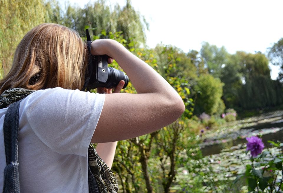 Student from the University of Virginia, Lucy Call, photographs Monet's lily pond. ‚ÄúI knew Monet growing up, especially from my grandma. It was very cool to see (his gardens) after I had been learning about it my whole life,‚Äù she said.