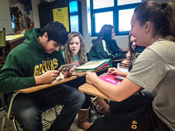 Greenwood High School students, in Bowling Green, Kentucky, read postcards that were sent from Payton Taylor on the Fall 2014 Voyage.