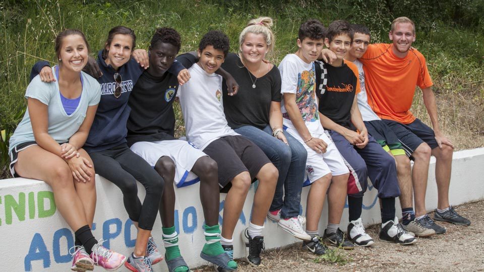 Hanging out with new friends after playing soccer.