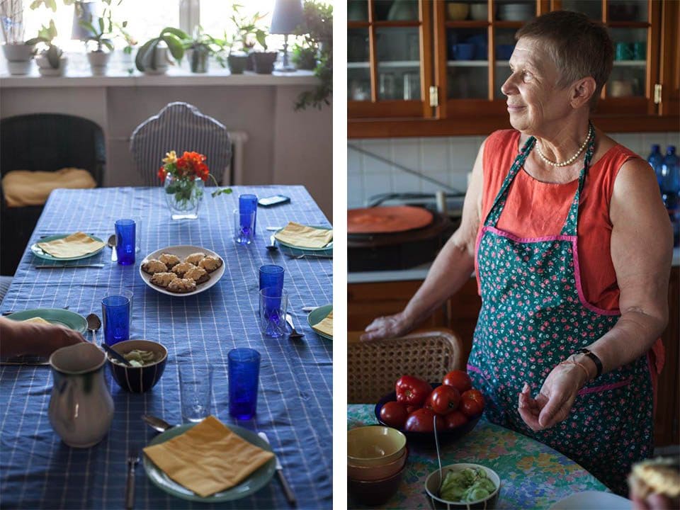 The table set with appetizers. At right, Maila speaks about her home in the countryside where the full bowl of fresh tomatoes came from.