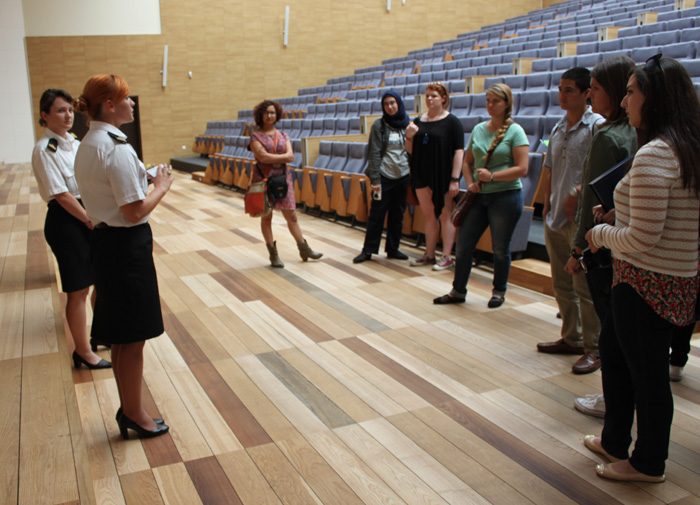 Touring the large lecture room at the Polish Naval Academy.