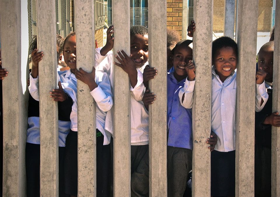 jordan_loewe_IMG_4314 Kids who are part of the Operation Hunger program are excited to see the visitors from the Biomedical Ethics Field Lab in Cape Town. Photo by Jordan Loewe