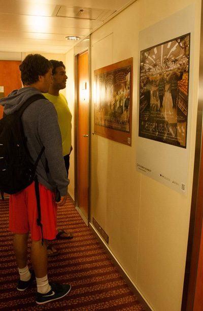 Students check out the Lexicon of Sustainability posters that define Community Supported Agriculture (CSA) and Veggie Libel Law.