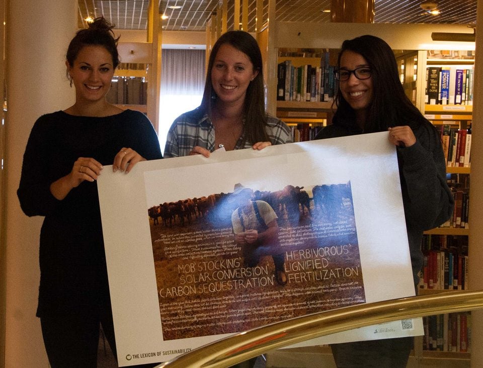 Students in the Sustainability Communities class with just one of the 20 "informational artworks" from the Lexicon of Sustainability project.