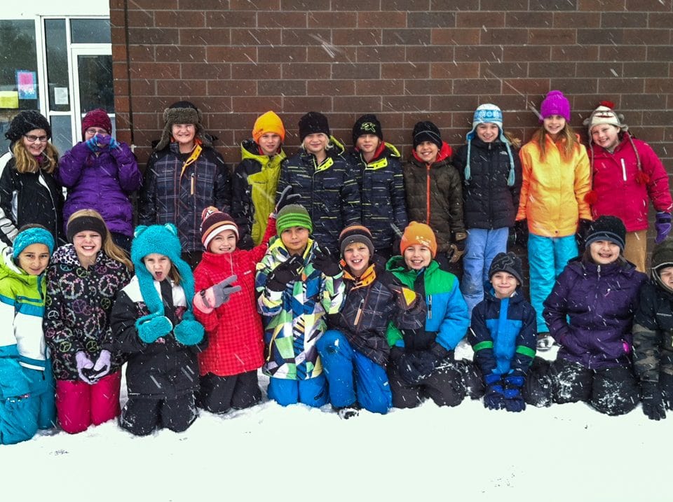 Lizzie Narlock's Vicarious Voyage class of third and fourth graders at Riverside Elementary in Weston, Wisconsin share a group photo with her while she's aboard the MV Explorer this semester. Photo courtesy of Bonnie Goertz