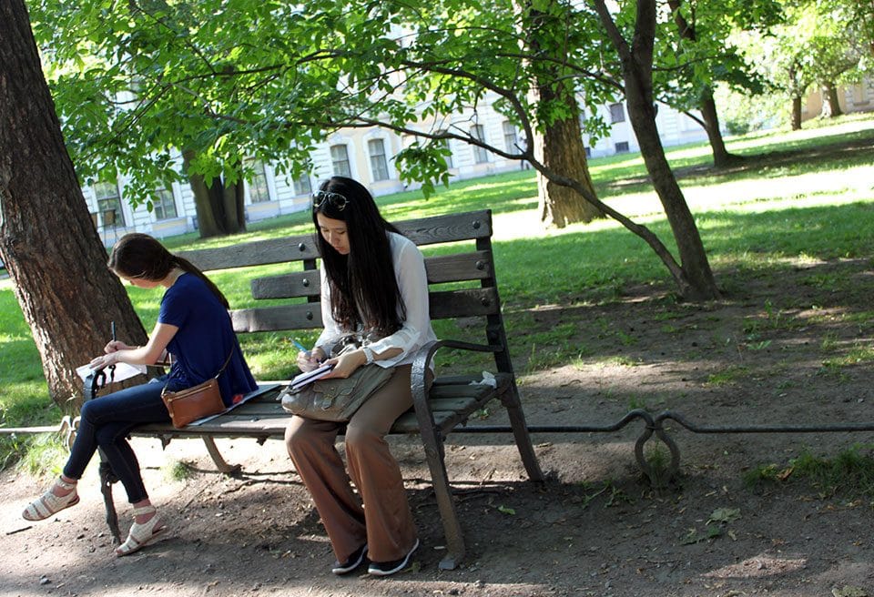 TK and Ida Kusumastuti reflect and take notes in the courtyard behind the Sheremetyev Palace, where Russian writer Anna Akhmatova once lived.